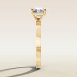 Emerald East West engagement ring in yellow gold, side profile