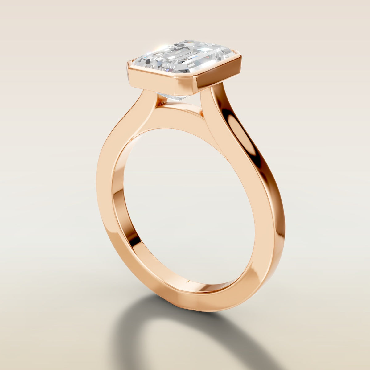 Emerald Full Bezel Cathedral engagement ring in rose gold, angled side view