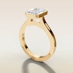 Emerald Full Bezel Cathedral engagement ring in gold, angled side view