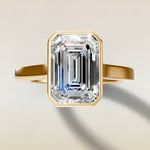 Emerald Full Bezel Cathedral engagement ring in gold, top view