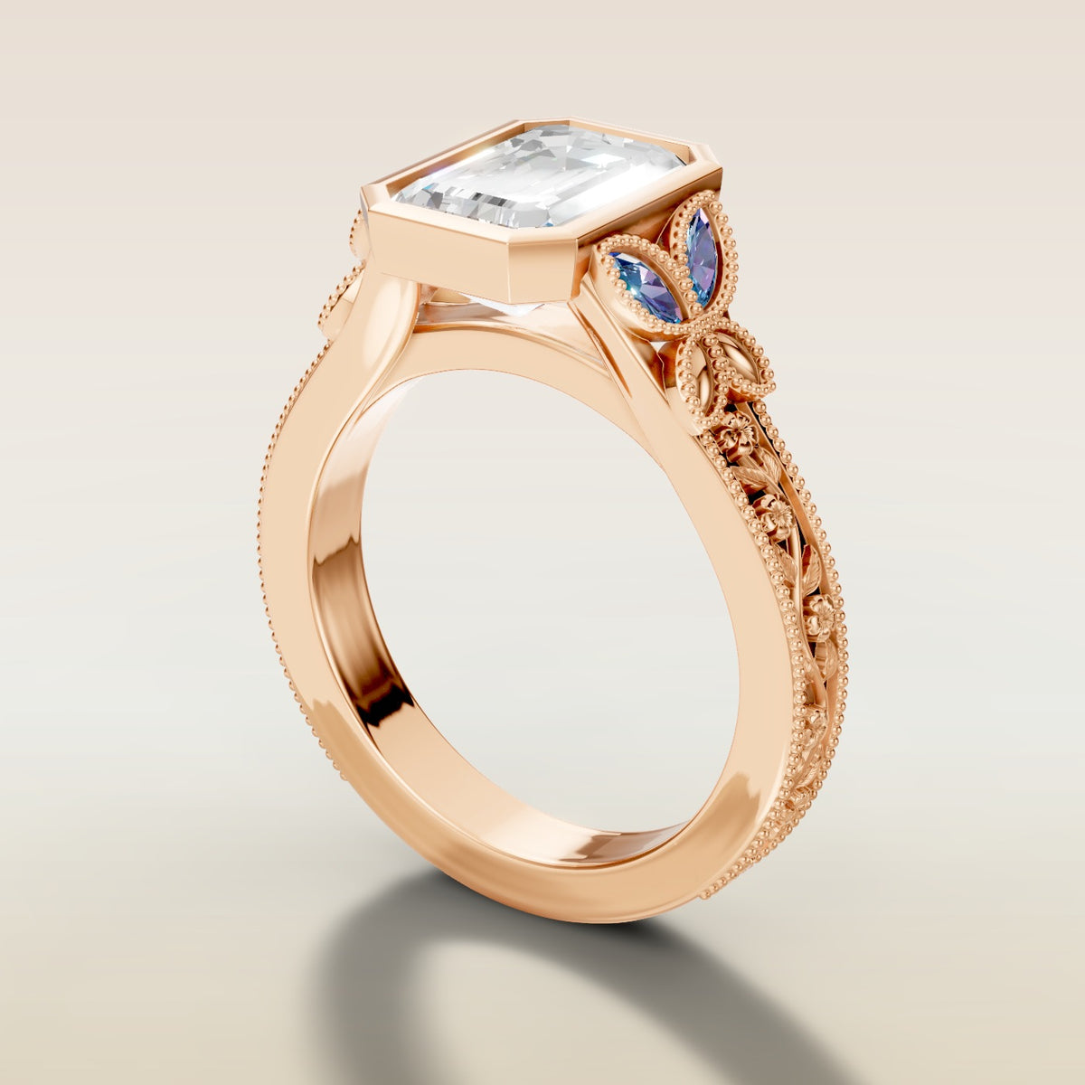 Emerald Full Bezel Floral Engraved engagement ring in rose gold, angled side view