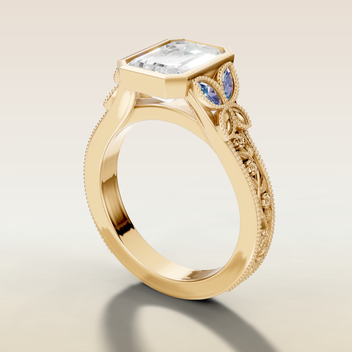 Emerald Full Bezel Floral Engraved engagement ring in yellow gold, angled side view