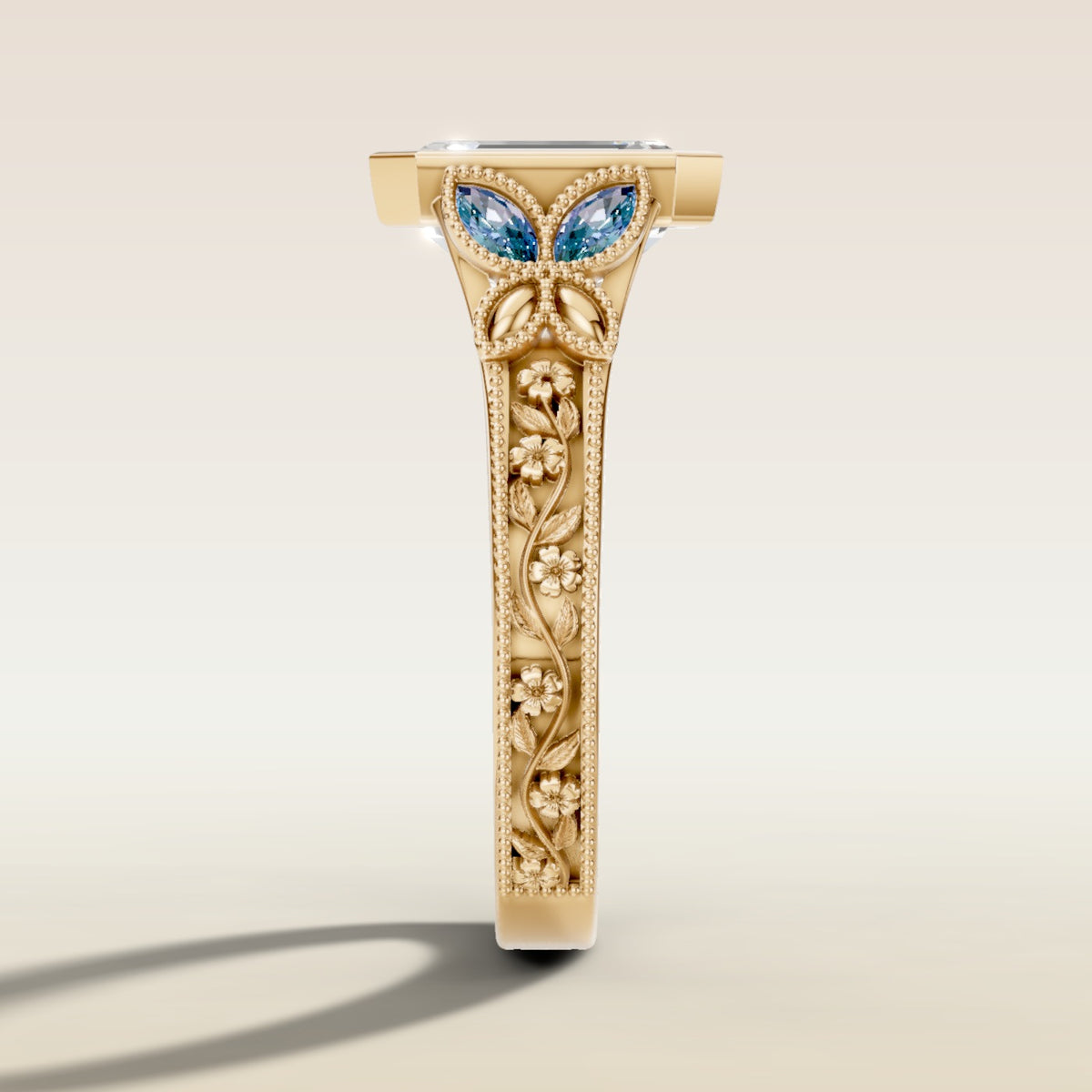 Emerald Full Bezel Floral Engraved engagement ring in yellow gold, side profile