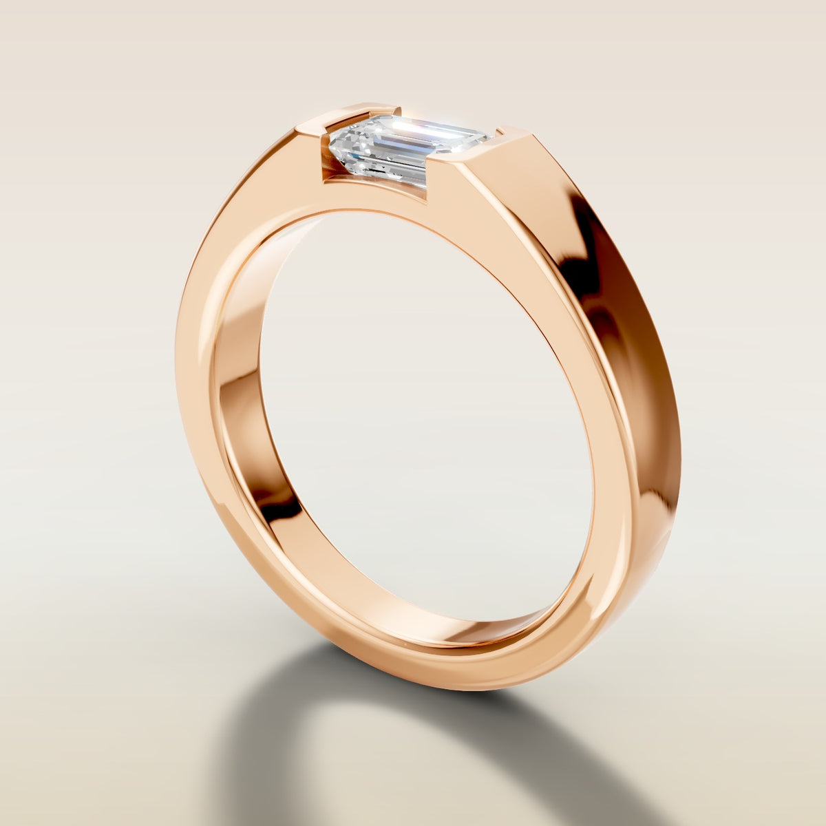 Emerald Half Bezel Low Profile engagement ring in rose gold, angled side view