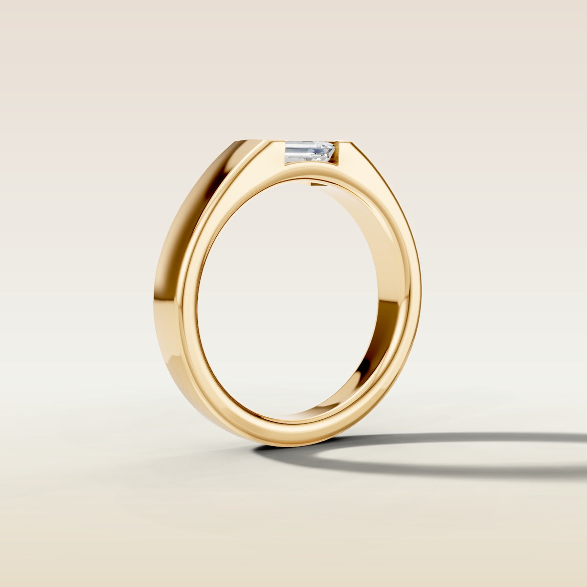 Emerald Half Bezel Low Profile engagement ring in gold, angled side view