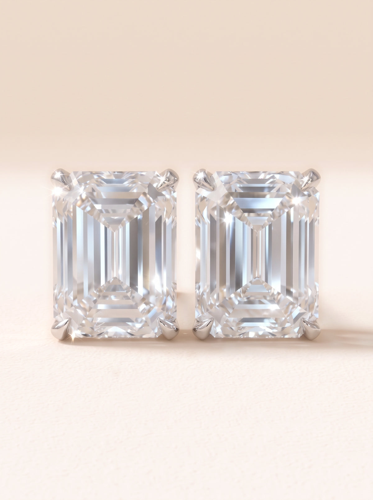 Emerald cut diamond stud earrings in 14K white gold