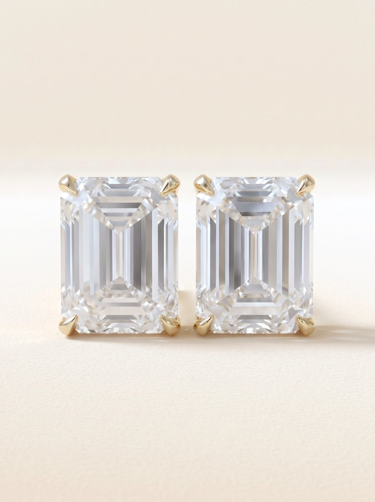 Emerald cut diamond stud earrings in 14K yellow gold