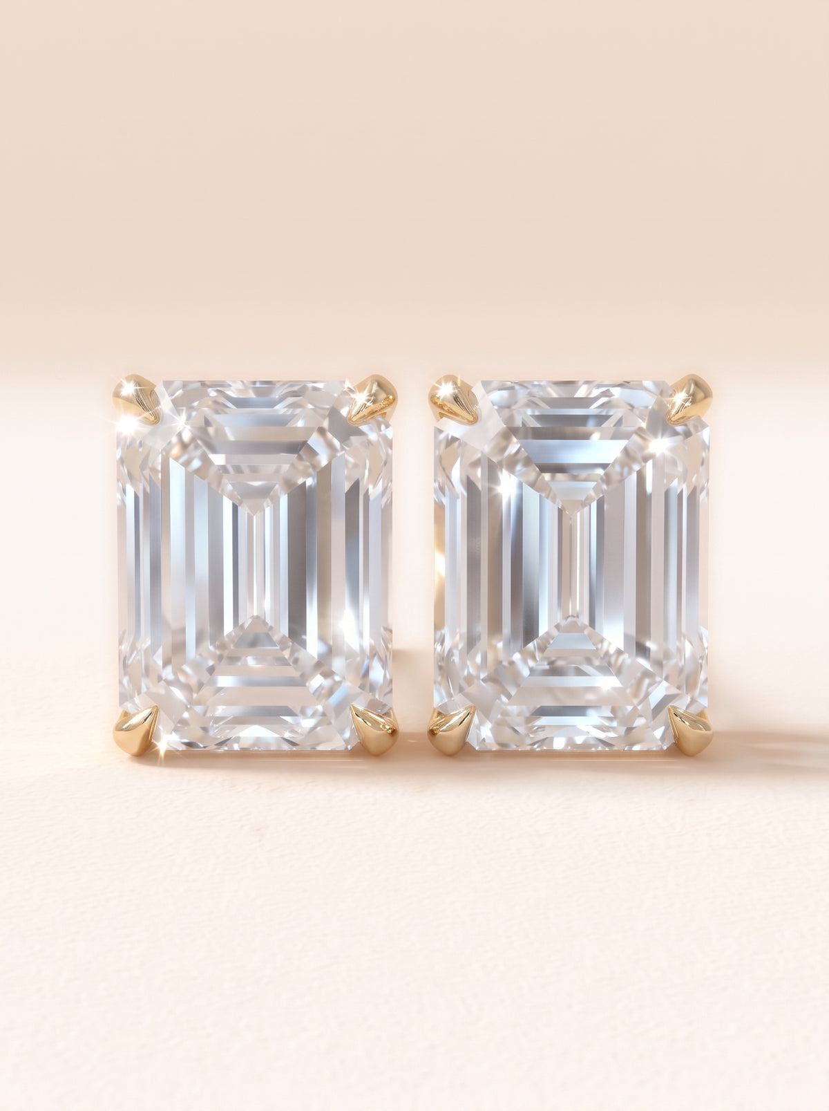 Emerald cut diamond stud earrings in 14K yellow gold