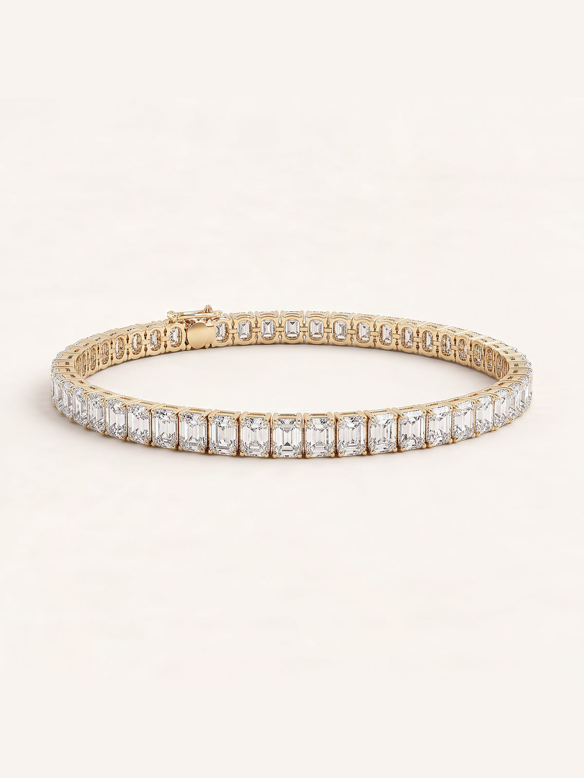 Emerald shaped diamond tennis bracelet in 14K yellow gold