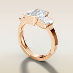 Emerald Three Stone Half Bezel Thick Band engagement ring in rose gold, angled side view