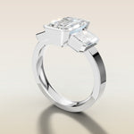 Emerald Three Stone Half Bezel Thick Band engagement ring in white gold, angled side view