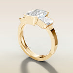 Emerald Three Stone Half Bezel Thick Band engagement ring in yellow gold, angled side view