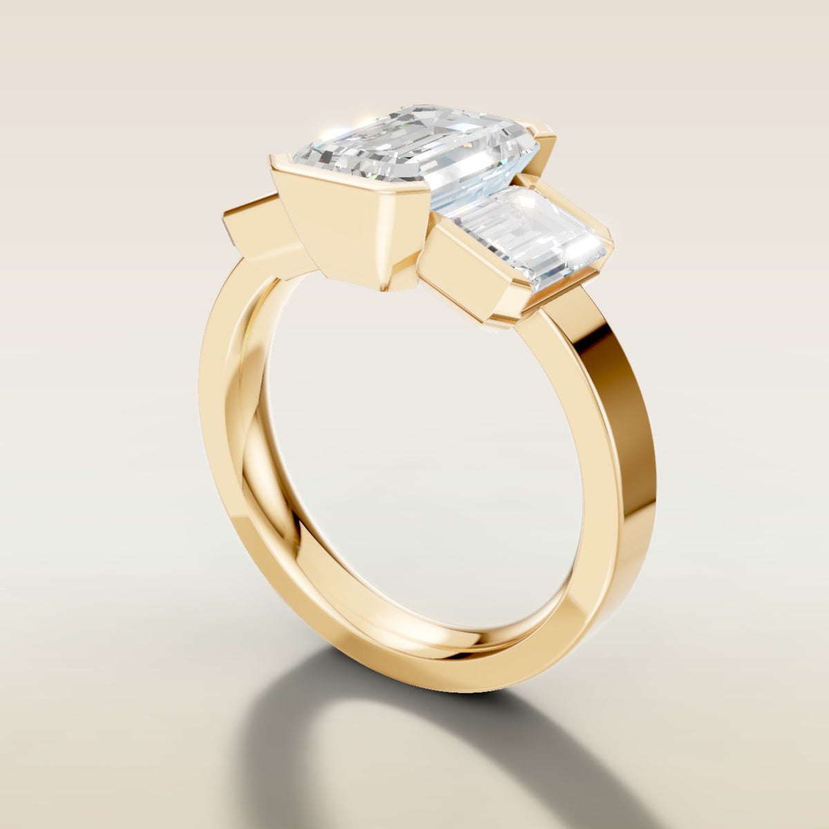 Emerald Three Stone Half Bezel Thick Band engagement ring in yellow gold, angled side view