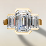 Emerald Three Stone Half Bezel Thick Band engagement ring in yellow gold, top view