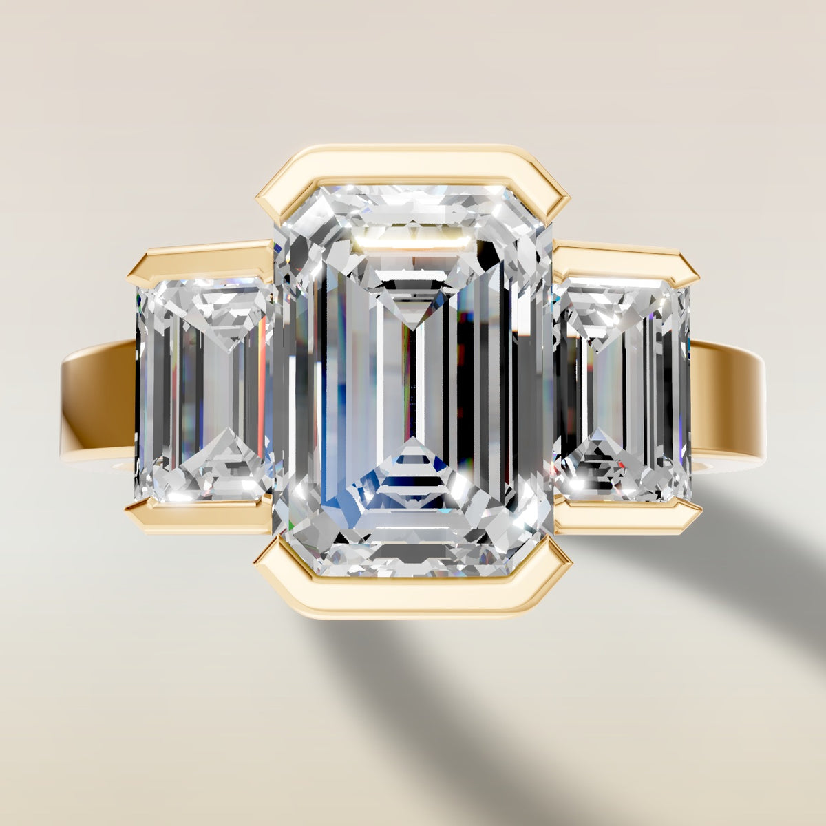 Emerald Three Stone Half Bezel Thick Band engagement ring in yellow gold, top view