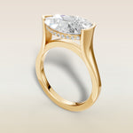 Pear Half Bezel with Hidden Halo engagement ring in yellow gold, angled view