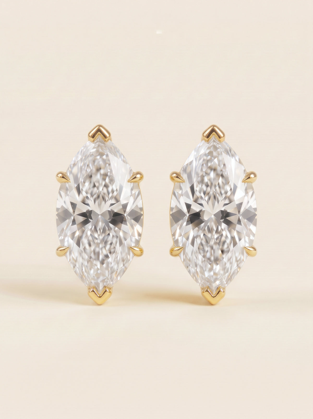 Marquise diamond stud earrings in 14K yellow gold