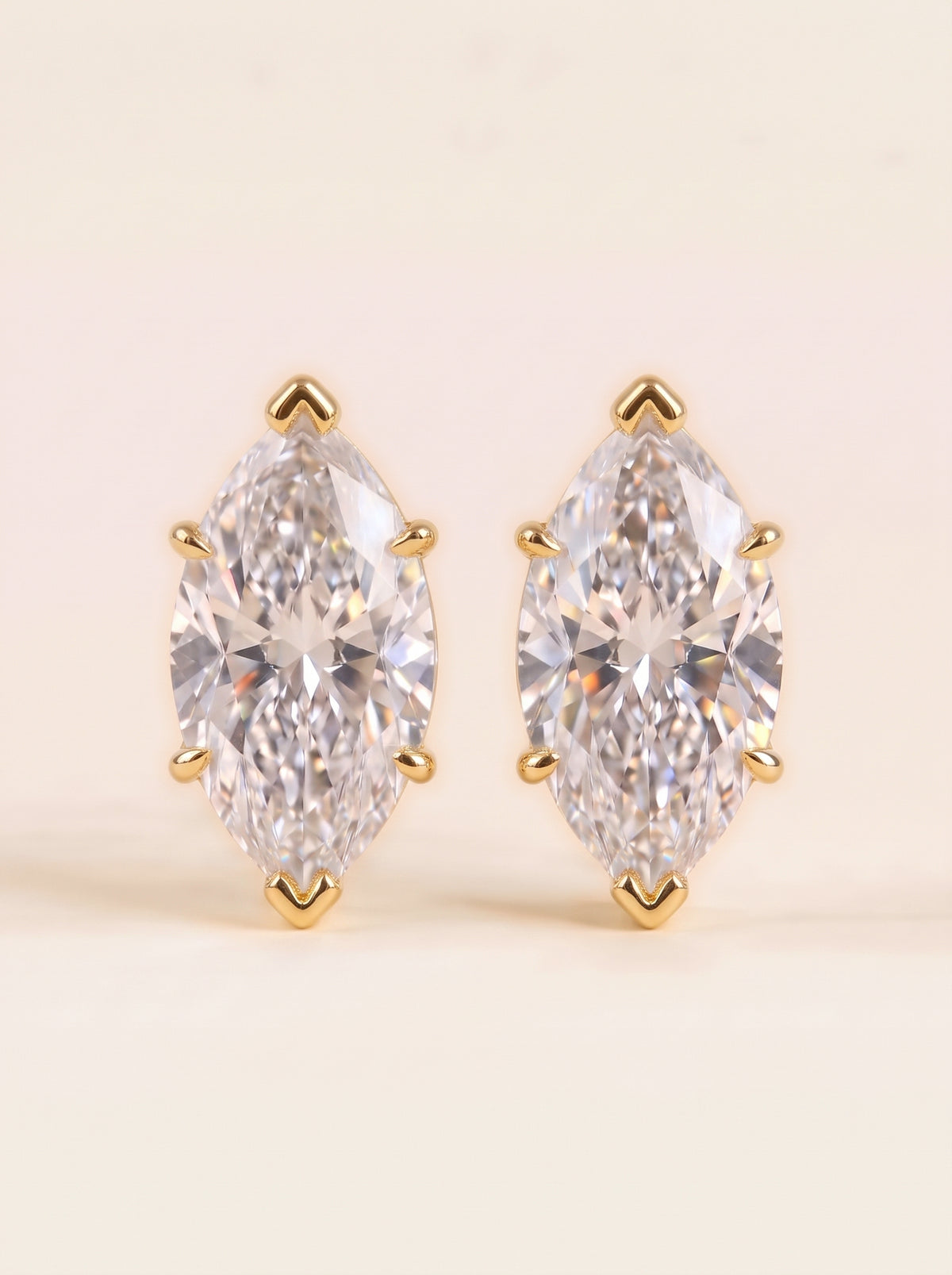 Marquise diamond stud earrings in 14K yellow gold