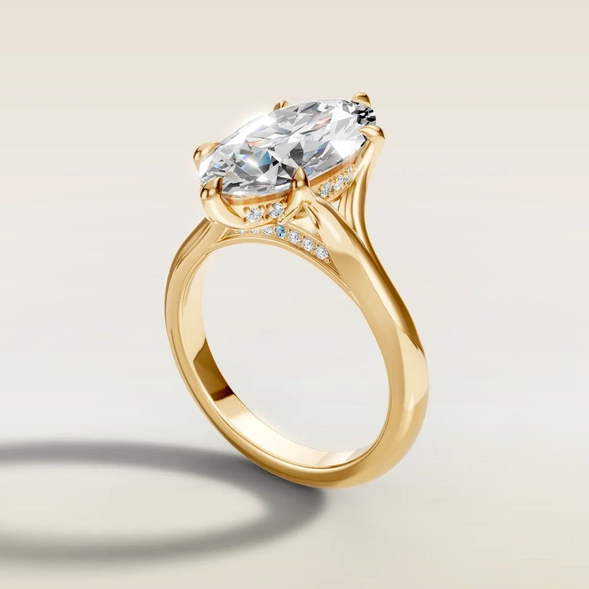 Moval 6 Tulip Hidden Halo Split Shank engagement ring in yellow gold, angled side view