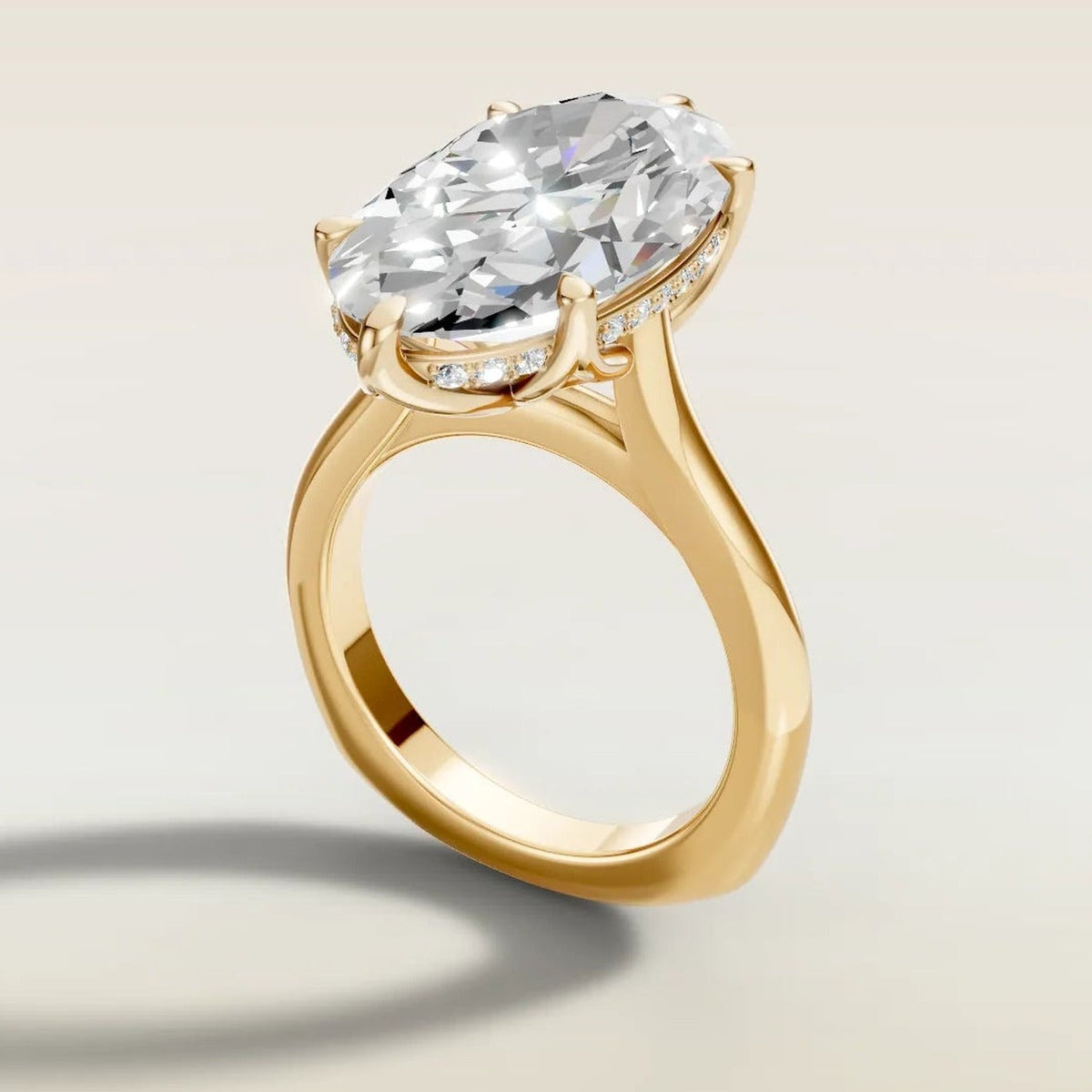 Moval 6 Tulip Hidden Halo engagement ring in yellow gold, angled side view