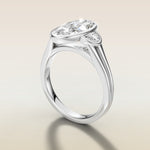 Moval Three Stone Full Bezel engagement ring in white gold, angled side view