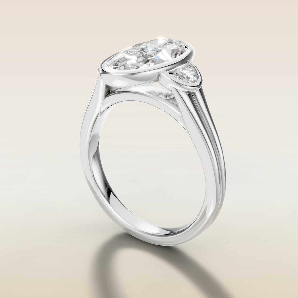 Moval Three Stone Full Bezel engagement ring in white gold, angled side view