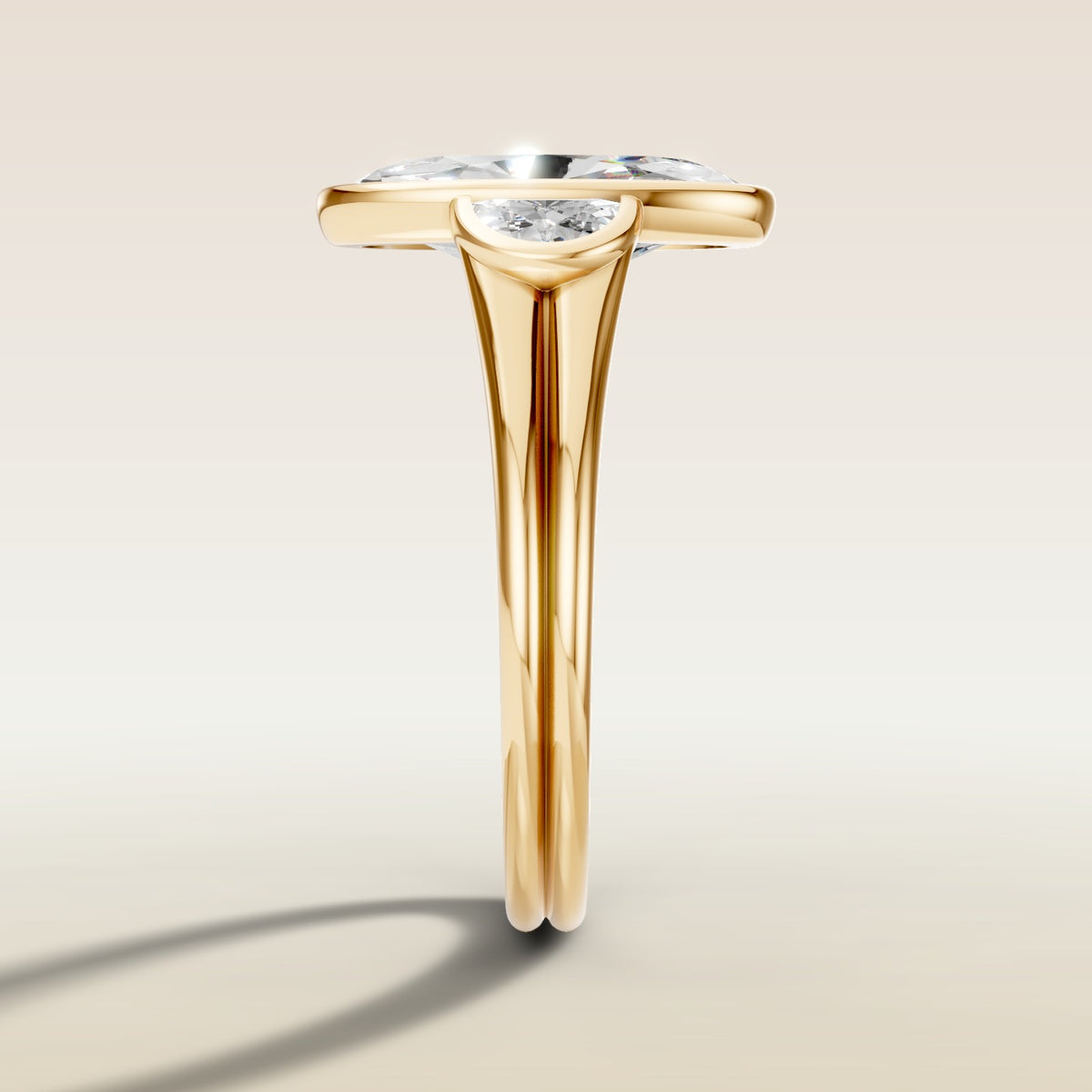 Moval Three Stone Full Bezel engagement ring in yellow gold, side profile