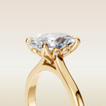Oval Four Petal Diamond Tulip engagement ring in yellow gold, basket close up