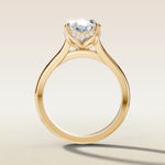 Oval Four Petal Tulip Curved Hidden Halo engagement ring in yellow gold, front view