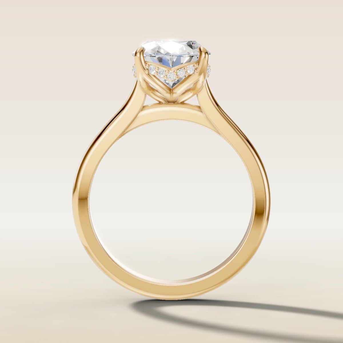 Oval Four Petal Tulip Curved Hidden Halo engagement ring in yellow gold, front view
