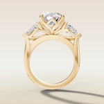 Oval Four Petal Tulip Three Stone engagement ring in yellow gold, front view