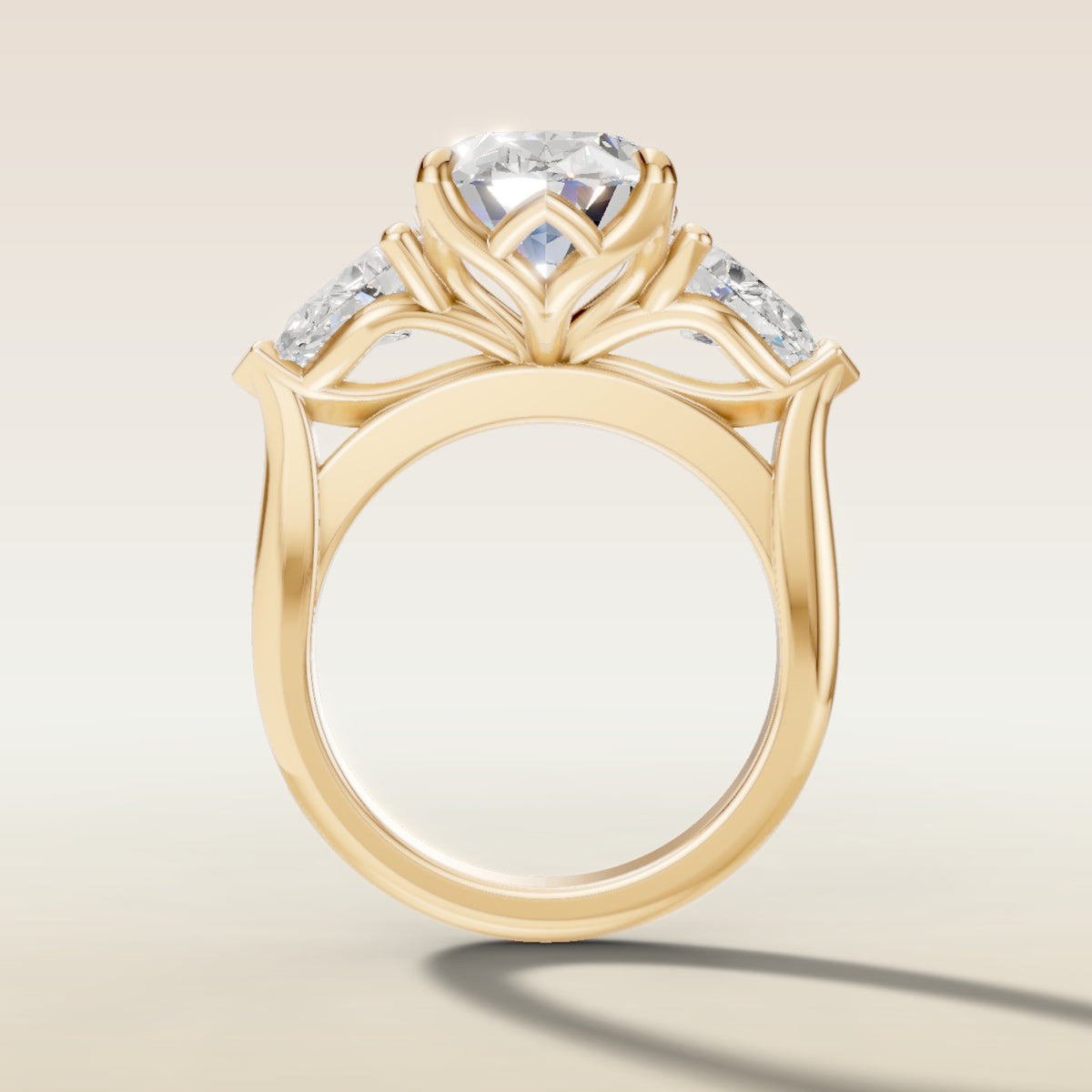 Oval Four Petal Tulip Three Stone engagement ring in yellow gold, front view