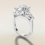 Oval Four Petal Tulip Three Stone engagement ring in white gold, angled side view