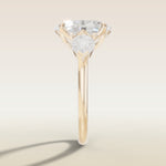 Oval Four Petal Tulip Three Stone engagement ring in yellow gold, side profile