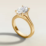 Oval Hidden Halo Double Band engagement ring in yellow gold, angled side view