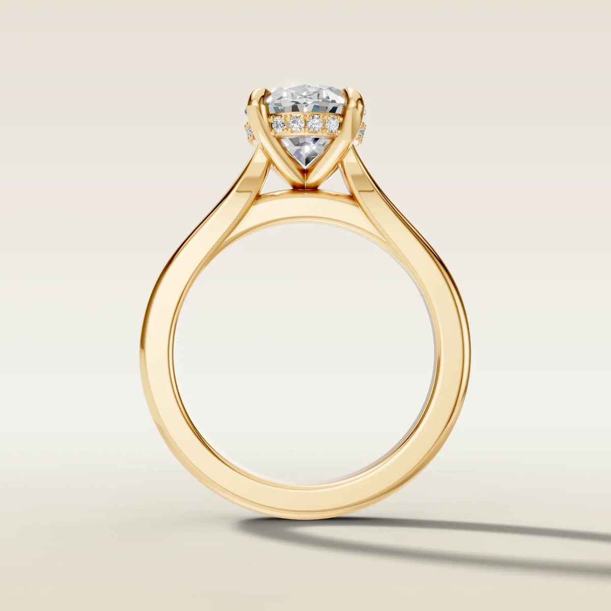 Oval Hidden Halo Double Band engagement ring in yellow gold, front view