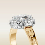 Oval Outer Halo Vintage Engraved engagement ring in gold, basket close up