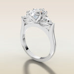 Oval Six Petal Tulip Three Stone engagement ring in white gold, angled side view