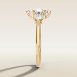 Oval Six Petal Tulip Three Stone engagement ring in yellow gold, side profile