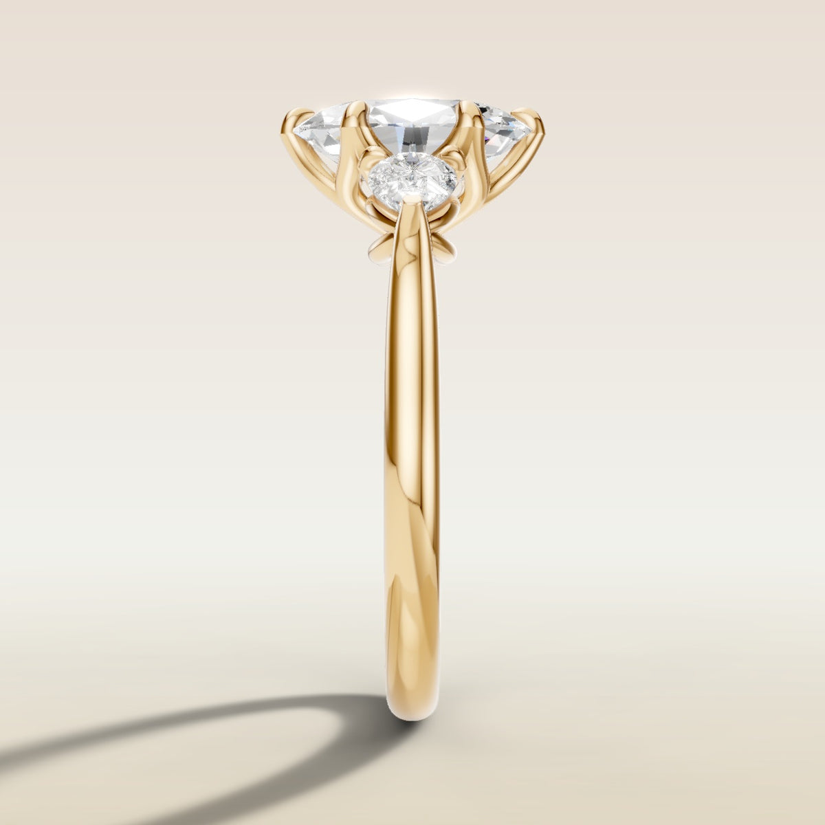 Oval Six Petal Tulip Three Stone engagement ring in yellow gold, side profile