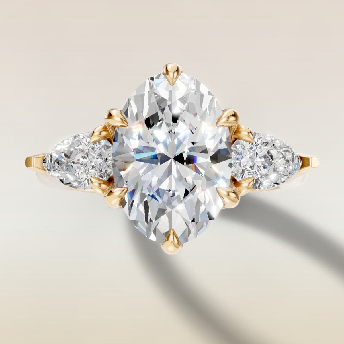 Oval Six Petal Tulip Three Stone engagement ring in yellow gold, top view