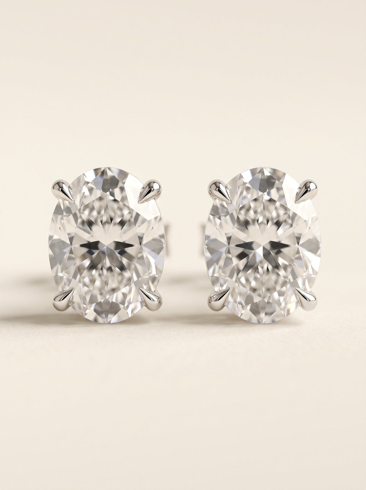 Oval diamond stud earrings in 14K white gold