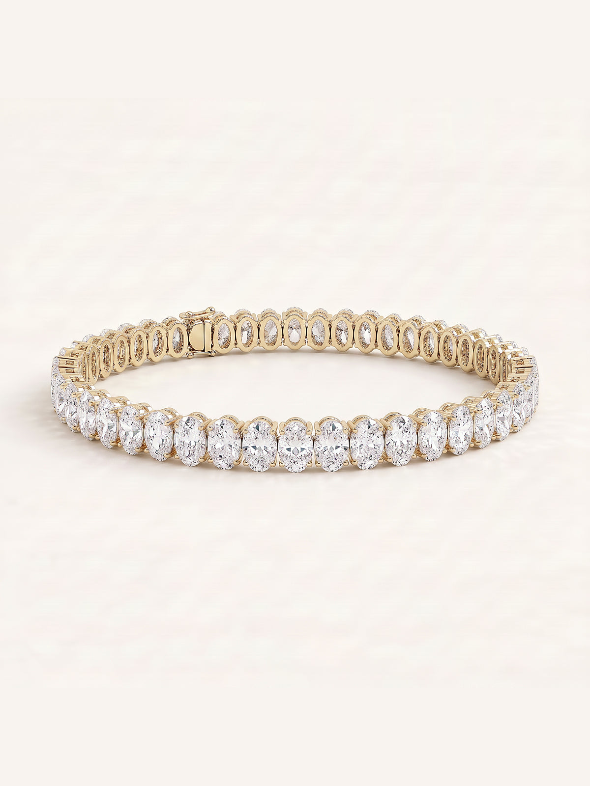 Oval shaped diamond tennis bracelet in 14K yellow gold