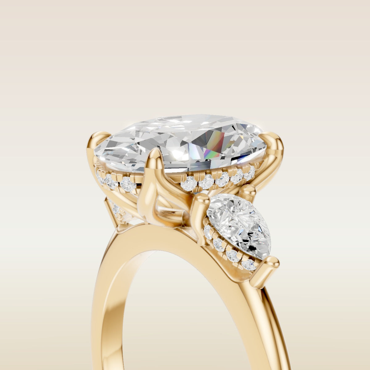 Oval Tulip Three Stone Hidden Halo engagement ring in yellow gold, basket close up