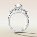 Oval Tulip Three Stone Hidden Halo engagement ring in white gold, front view