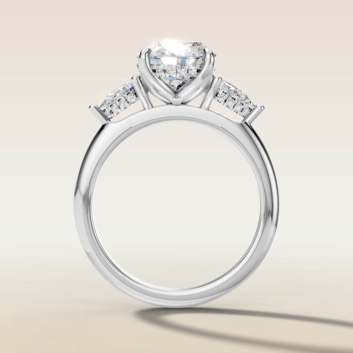 Oval Tulip Three Stone Hidden Halo engagement ring in white gold, front view