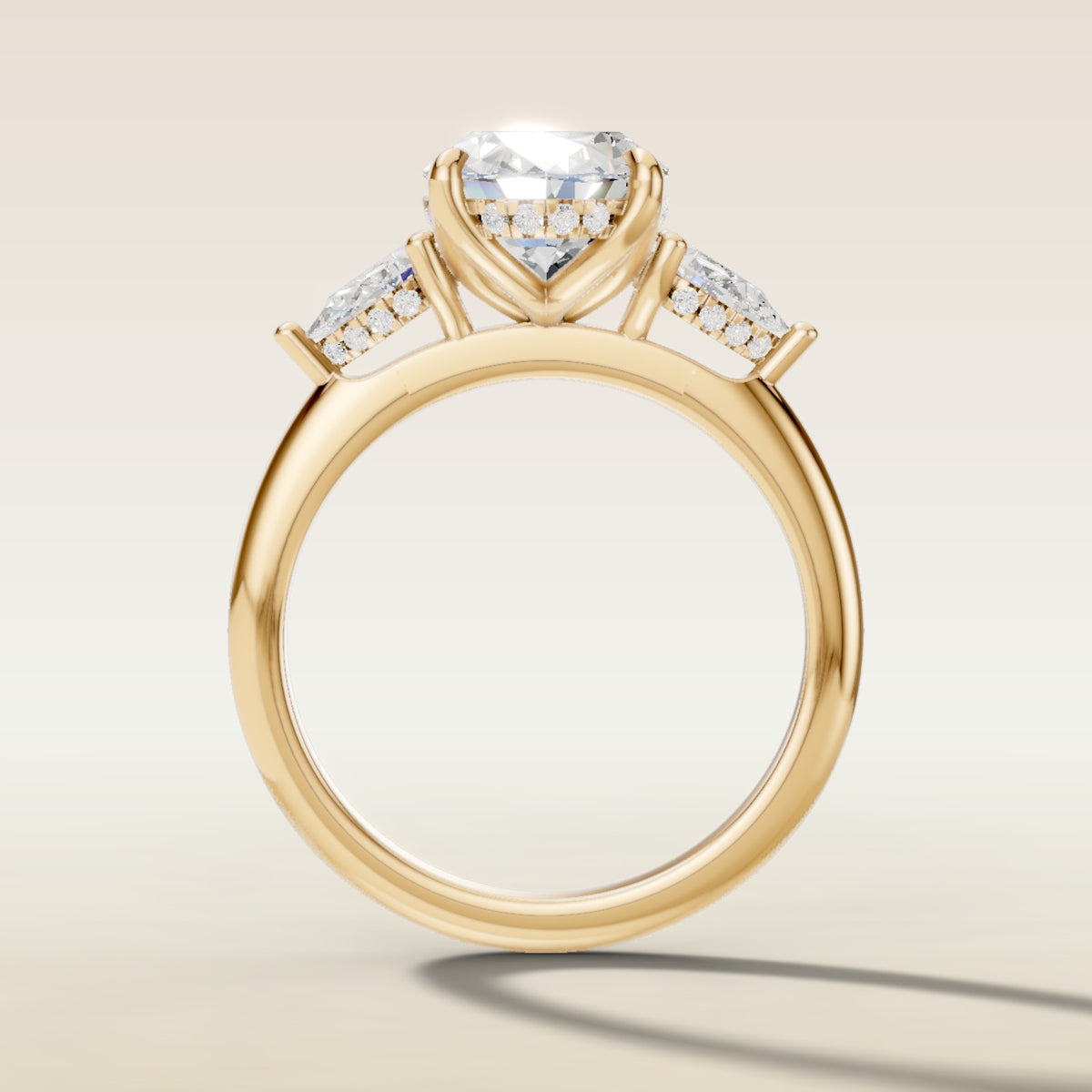 Oval Tulip Three Stone Hidden Halo engagement ring in yellow gold, front view
