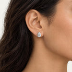 Pear shaped lab grown diamond stud earring worn on the ear