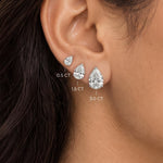 Pear shaped lab grown diamond stud earrings worn in 0.5, 1.5 and 3.0 carat sizes