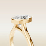 Pear Full Bezel Cathedral engagement ring in yellow gold, basket close up